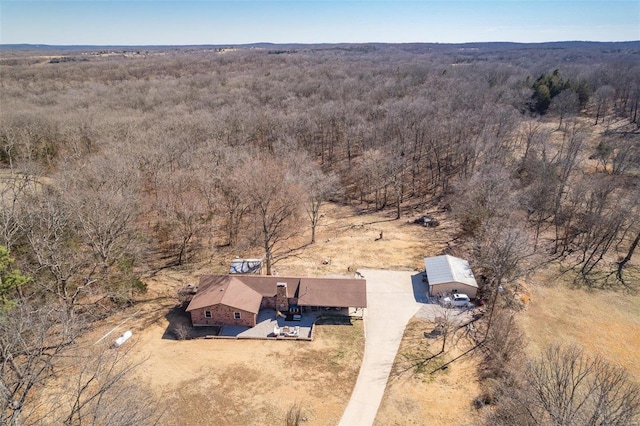 aerial view with a wooded view