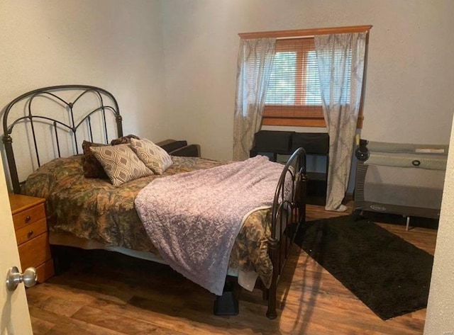 bedroom with wood finished floors