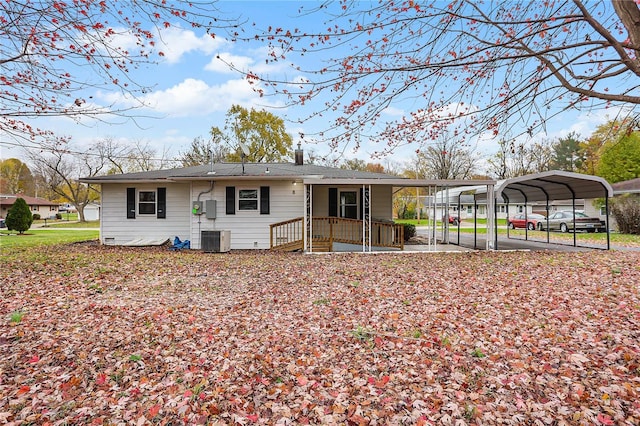 view of front of property with a detached carport and central air condition unit