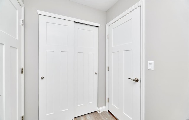 doorway with light wood-type flooring