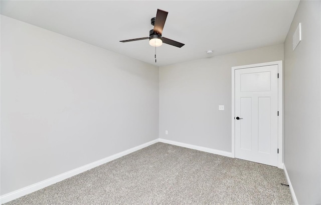 empty room featuring visible vents, carpet flooring, a ceiling fan, and baseboards