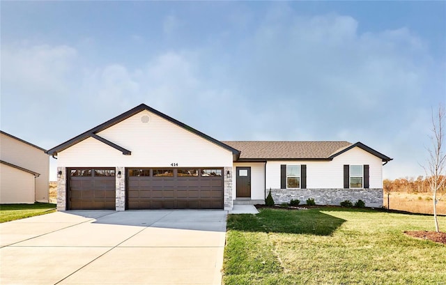 view of front of property with a garage, driveway, stone siding, and a front yard