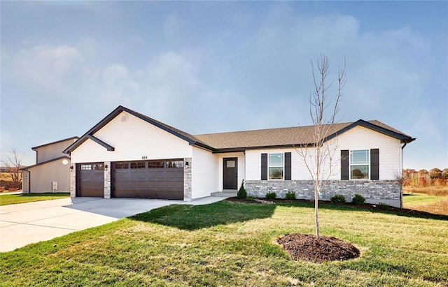 single story home with a garage, brick siding, driveway, and a front yard