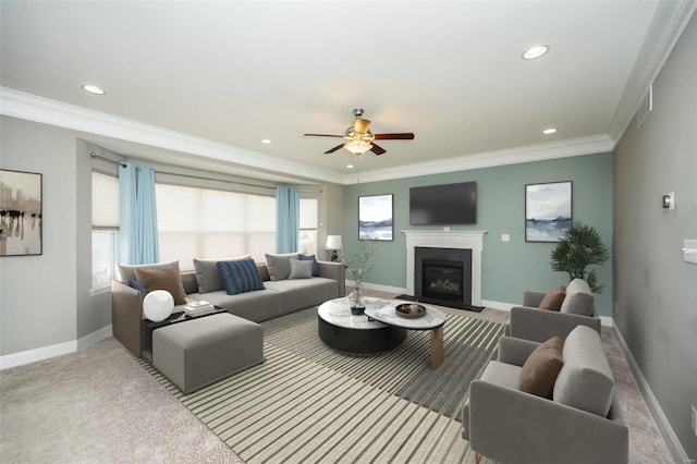 carpeted living room with ornamental molding, a healthy amount of sunlight, and baseboards