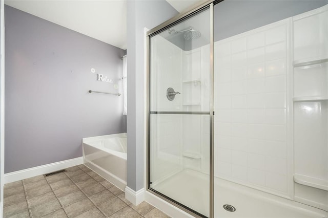 full bath featuring a garden tub, visible vents, a shower stall, baseboards, and tile patterned floors