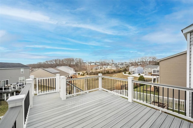 wooden deck featuring a residential view