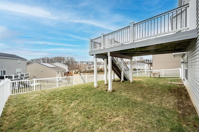 view of yard featuring stairs, a fenced backyard, and a wooden deck