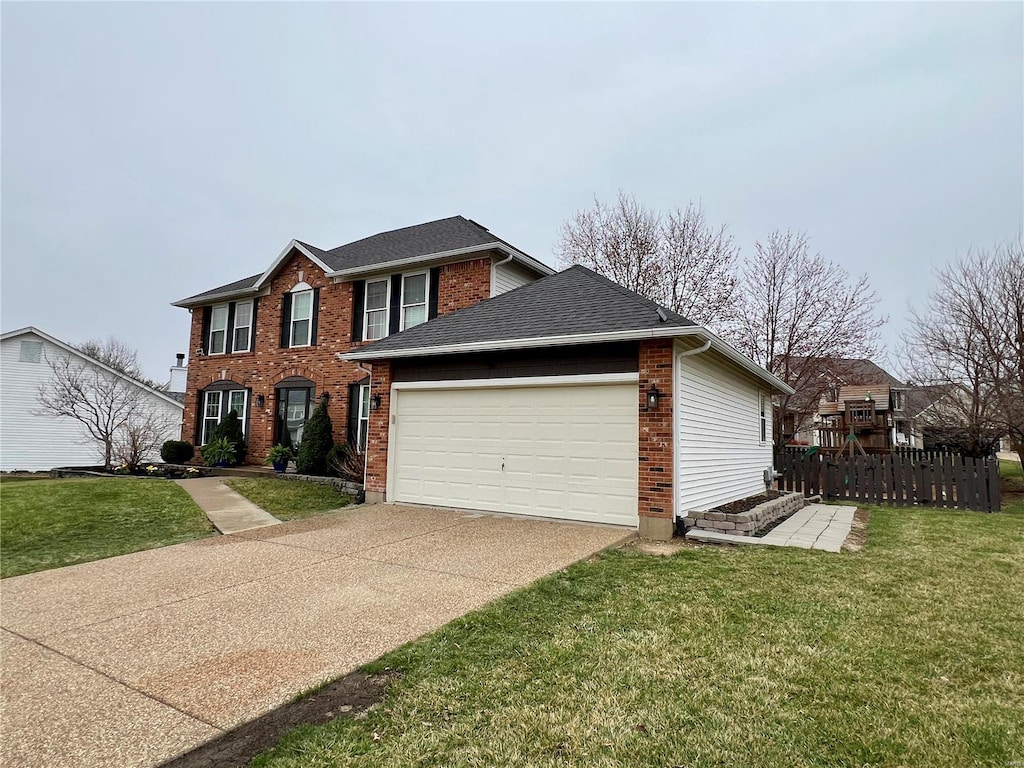 colonial home featuring brick siding, a front lawn, roof with shingles, driveway, and an attached garage