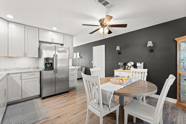 dining space with visible vents, baseboards, light wood-style flooring, ceiling fan, and recessed lighting