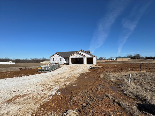 view of front of house with a rural view