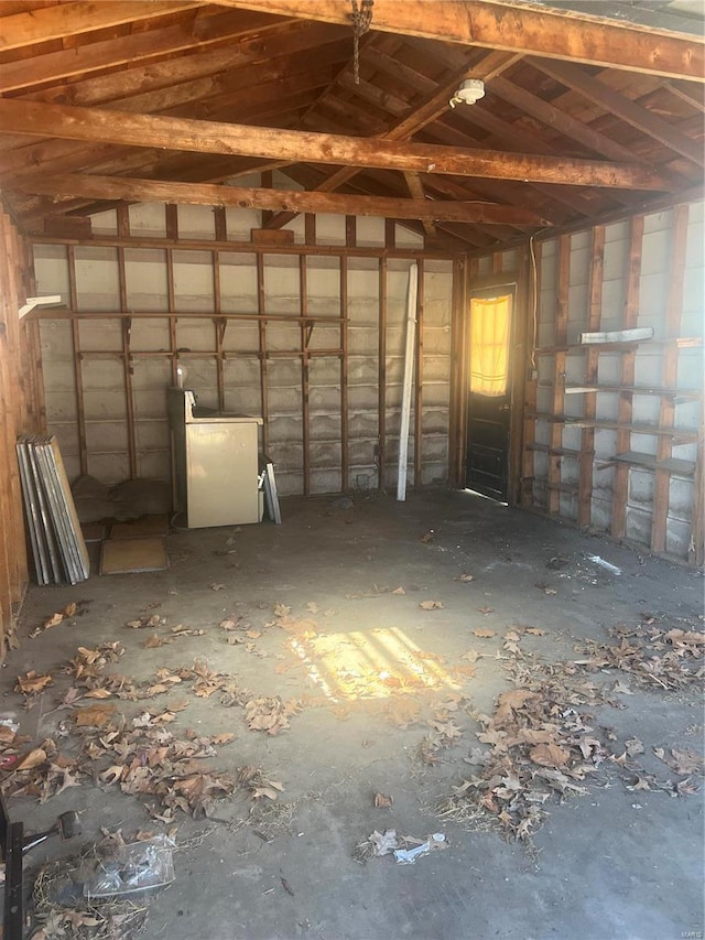 miscellaneous room featuring washer / dryer and vaulted ceiling