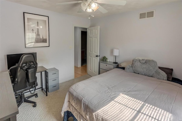 bedroom featuring baseboards, ceiling fan, visible vents, and carpet flooring