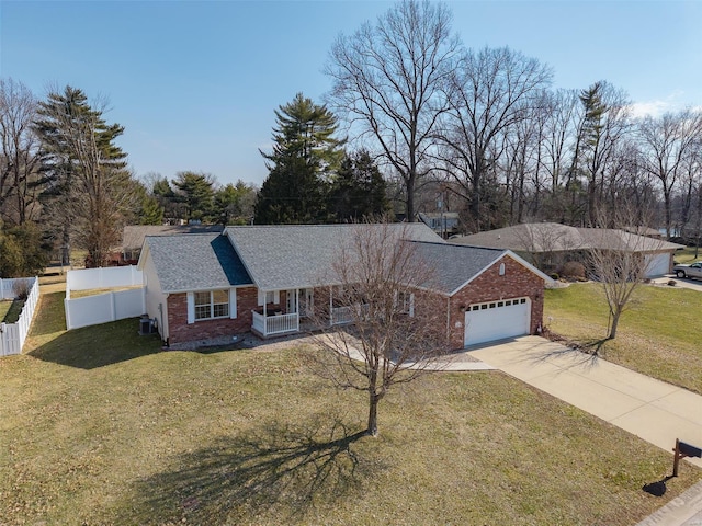 ranch-style house with a garage, a front yard, brick siding, and fence