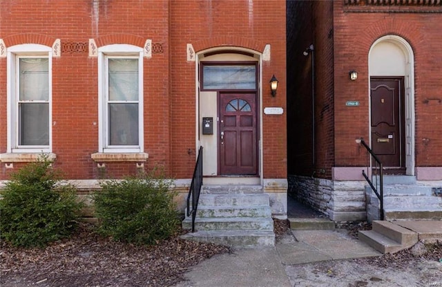 entrance to property with brick siding