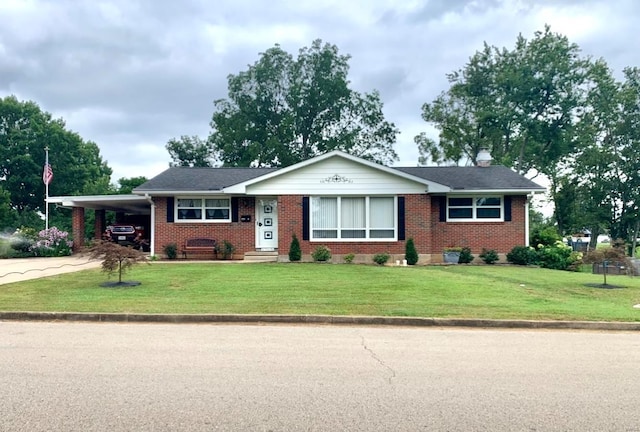 ranch-style home with driveway, a front lawn, an attached carport, and brick siding