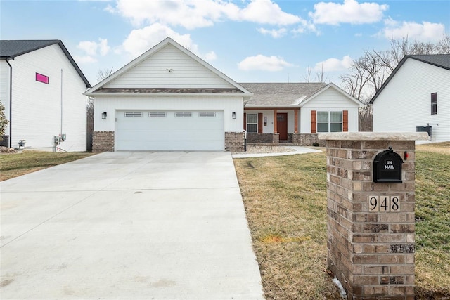 view of front of home with a garage, brick siding, a shingled roof, driveway, and a front lawn