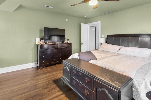 bedroom with a ceiling fan, dark wood finished floors, visible vents, and baseboards