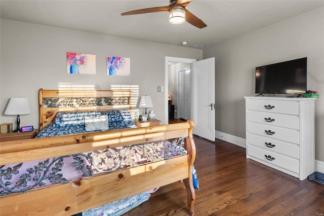 bedroom with dark wood-type flooring, visible vents, and baseboards