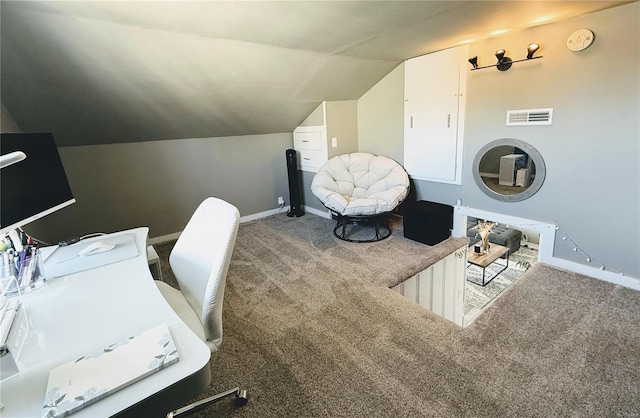 office with vaulted ceiling, carpet floors, visible vents, and baseboards