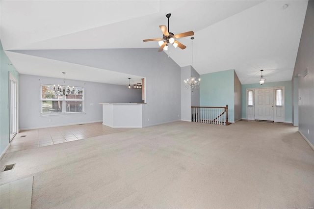 unfurnished living room featuring visible vents, light carpet, high vaulted ceiling, baseboards, and ceiling fan with notable chandelier