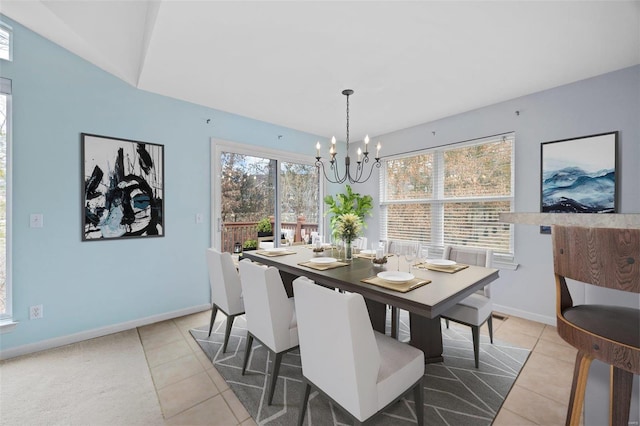 dining room featuring light tile patterned floors, baseboards, and a notable chandelier