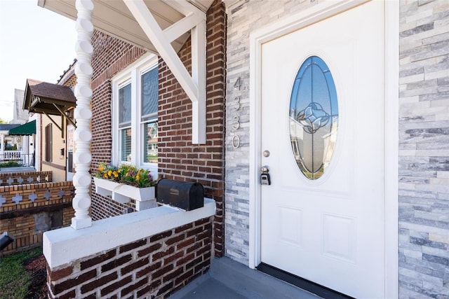 entrance to property with brick siding