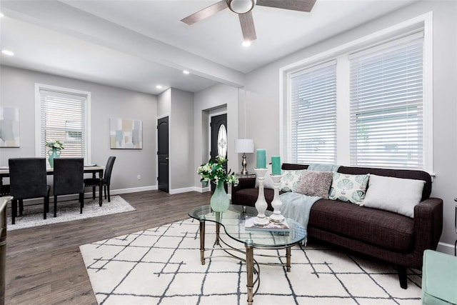 living area featuring ceiling fan, baseboards, wood finished floors, and recessed lighting