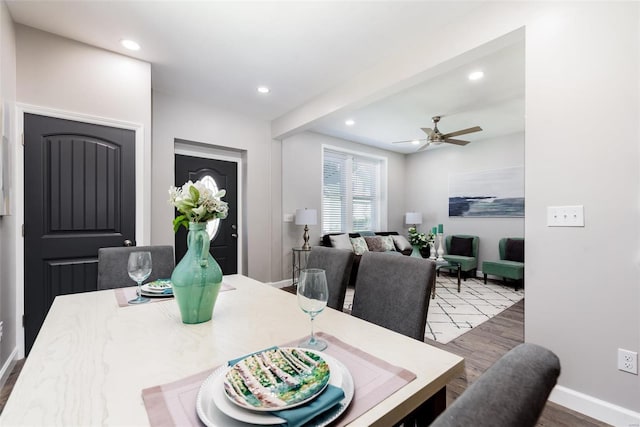 dining room with ceiling fan, baseboards, wood finished floors, and recessed lighting