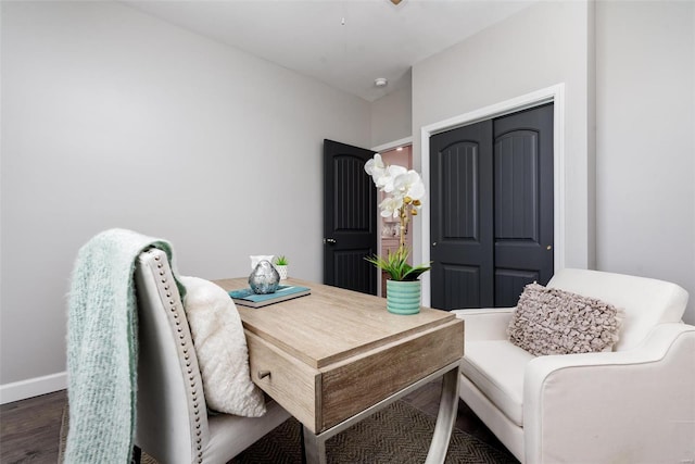 home office featuring dark wood-style flooring and baseboards