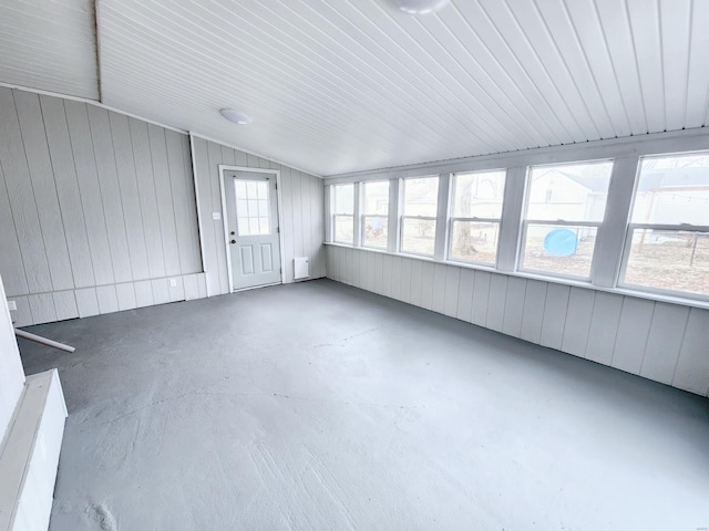 unfurnished sunroom with lofted ceiling