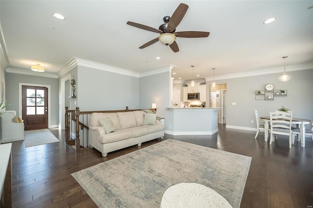 living room with baseboards, dark wood-type flooring, and ornamental molding