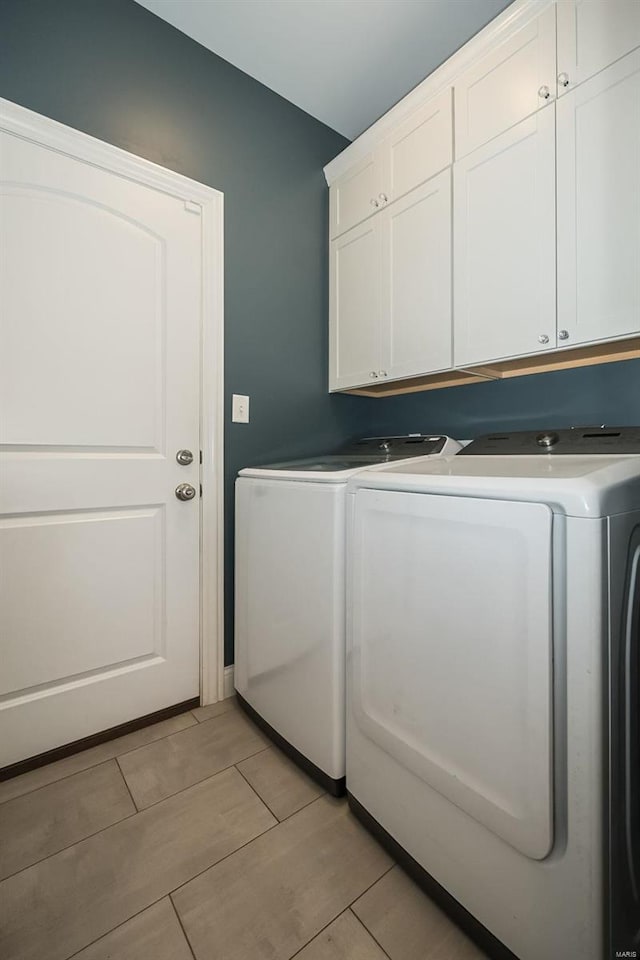 laundry area with cabinet space and washer and dryer