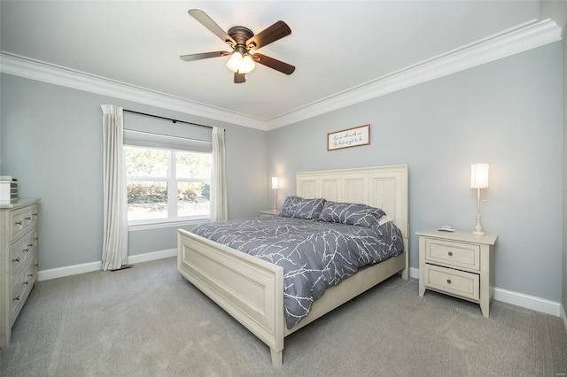 bedroom with a ceiling fan, baseboards, light colored carpet, and crown molding