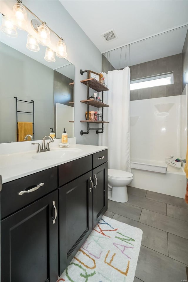 full bath with visible vents, shower / bathtub combination with curtain, toilet, and vanity