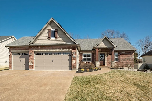 craftsman inspired home featuring a front lawn, driveway, a shingled roof, a garage, and brick siding