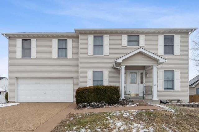 view of front of house with a garage and driveway