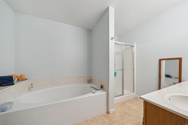 bathroom with a stall shower, vanity, a bath, and tile patterned floors