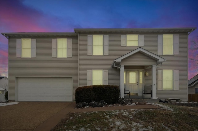 view of front facade with a garage and concrete driveway