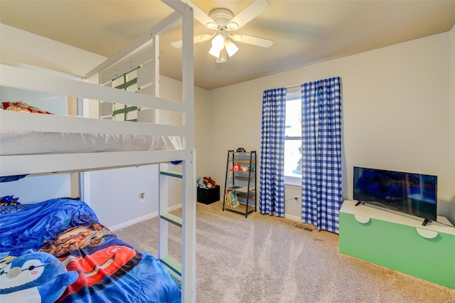 bedroom featuring carpet floors, visible vents, and a ceiling fan