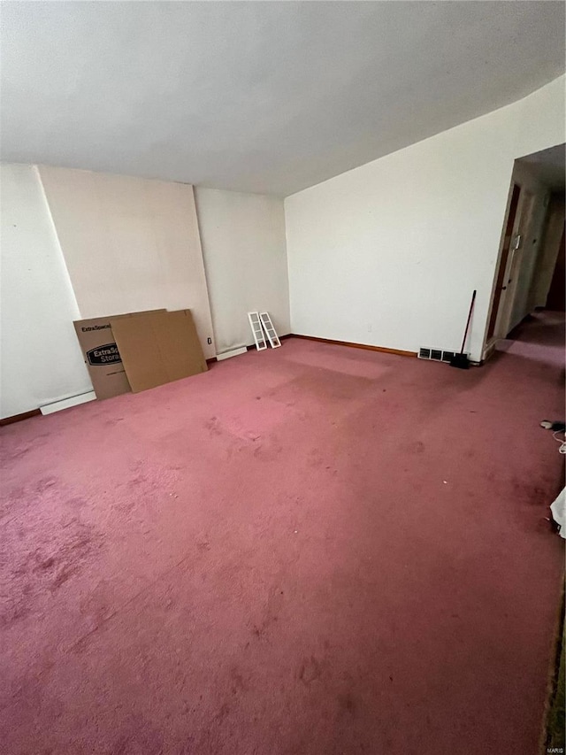 unfurnished room with carpet flooring