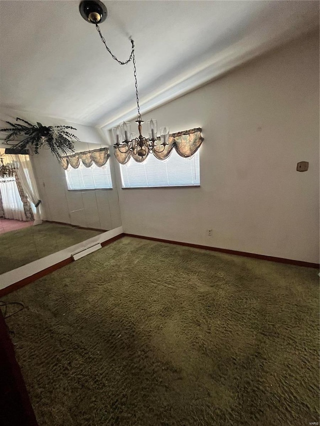 unfurnished dining area featuring carpet flooring, vaulted ceiling, and baseboards