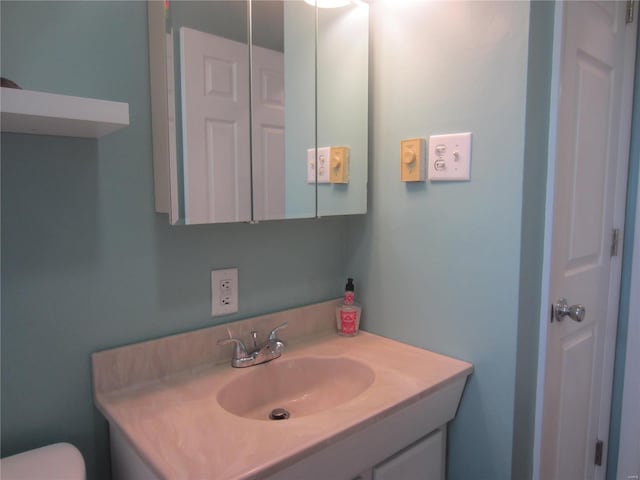 half bath with toilet and vanity