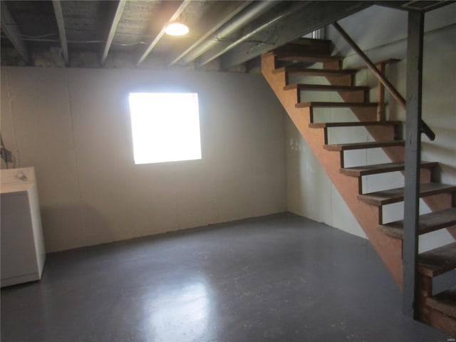 basement with stairs and washer / clothes dryer