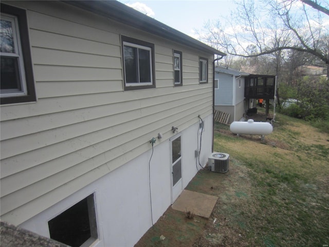 view of property exterior featuring central AC