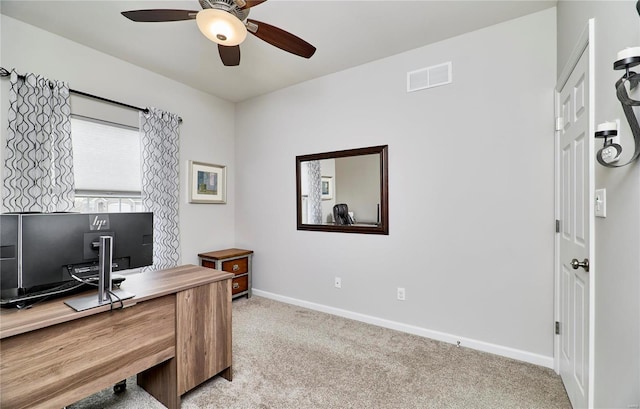 office with carpet floors, visible vents, baseboards, and a ceiling fan