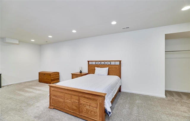 bedroom featuring light carpet, visible vents, and recessed lighting