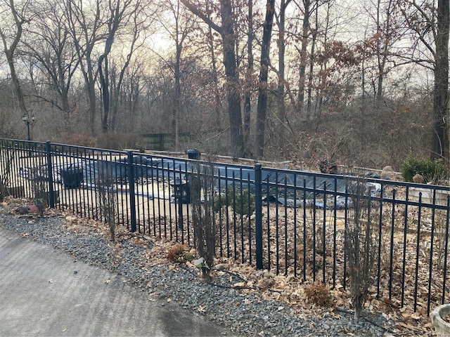 view of swimming pool with fence and a pool