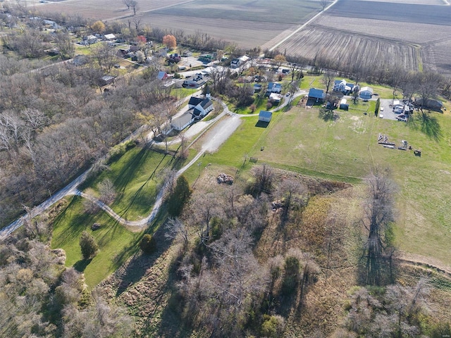 birds eye view of property with a rural view