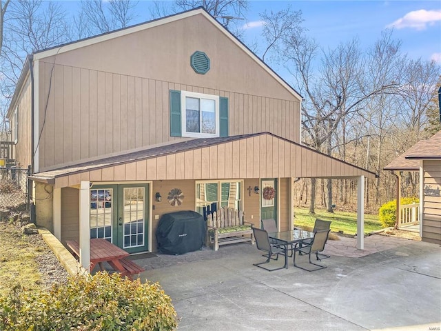 back of property featuring a patio