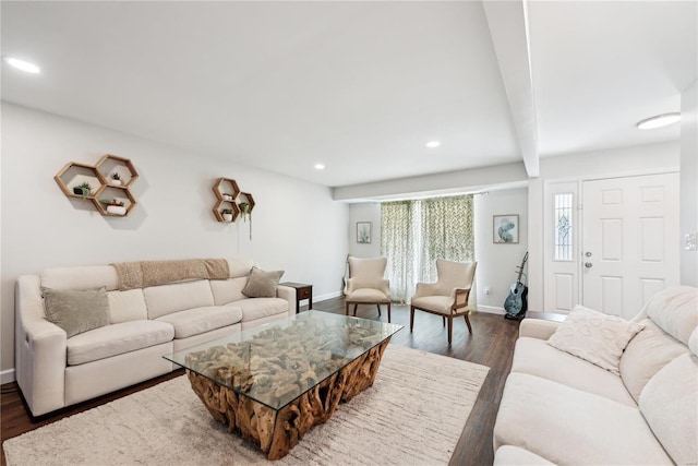 living room featuring baseboards, wood finished floors, beam ceiling, and recessed lighting